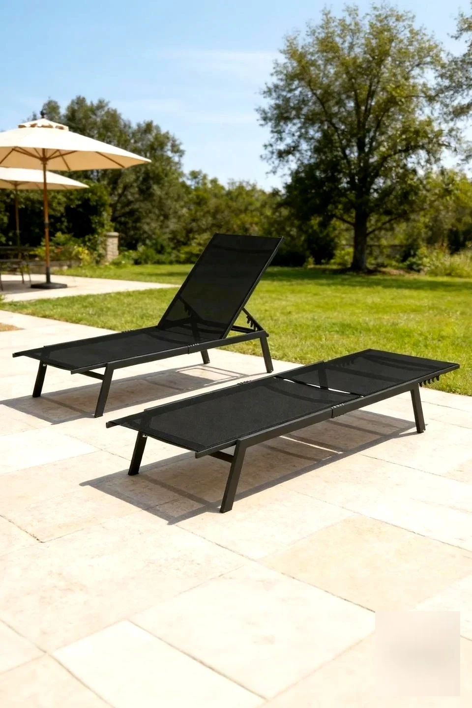 Transform Your Pool Into a Luxury Oasis with Curved Black Lounge Chairs — main image
